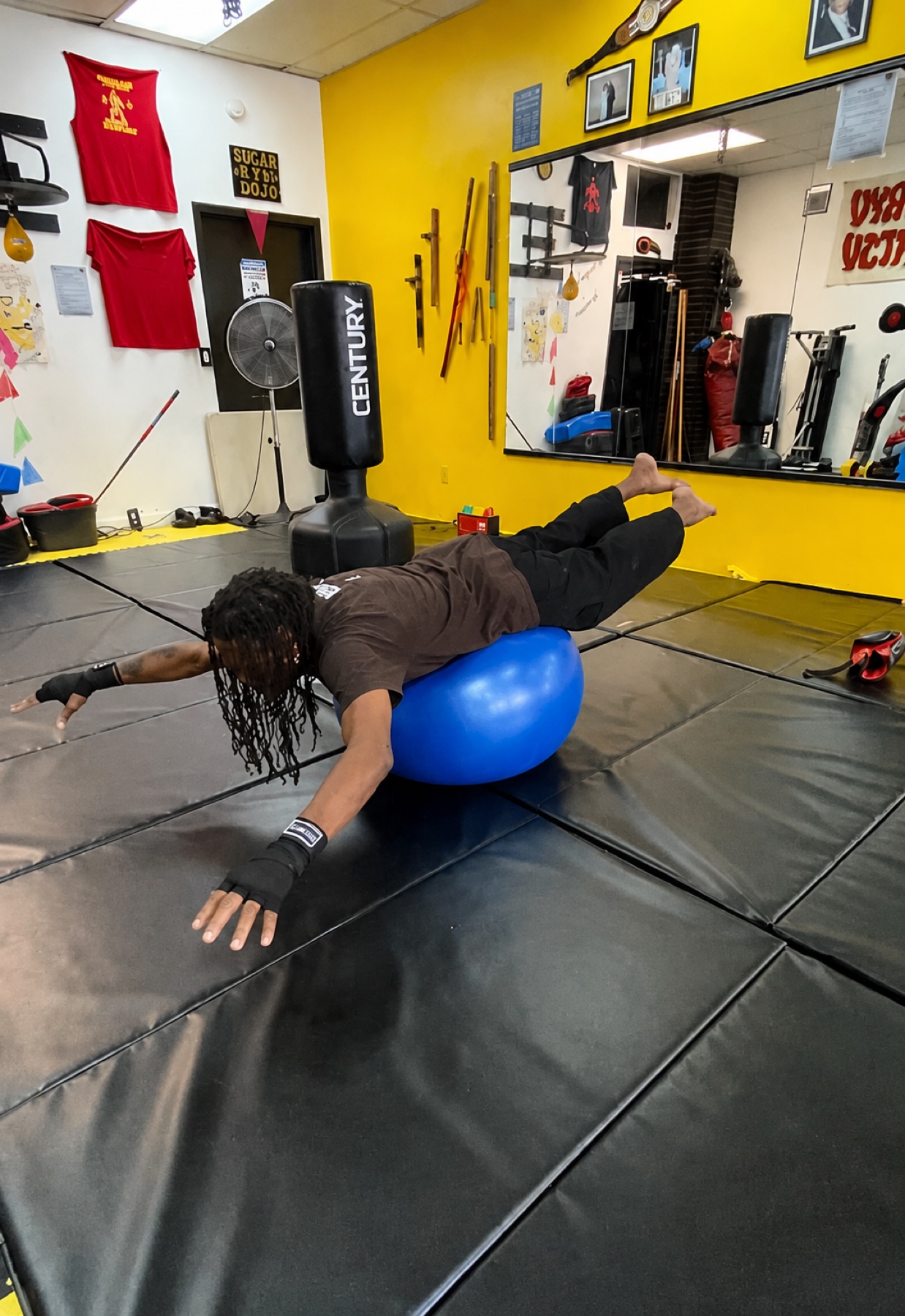 Adult Worthy Ryu student practicing conditioning on the mat