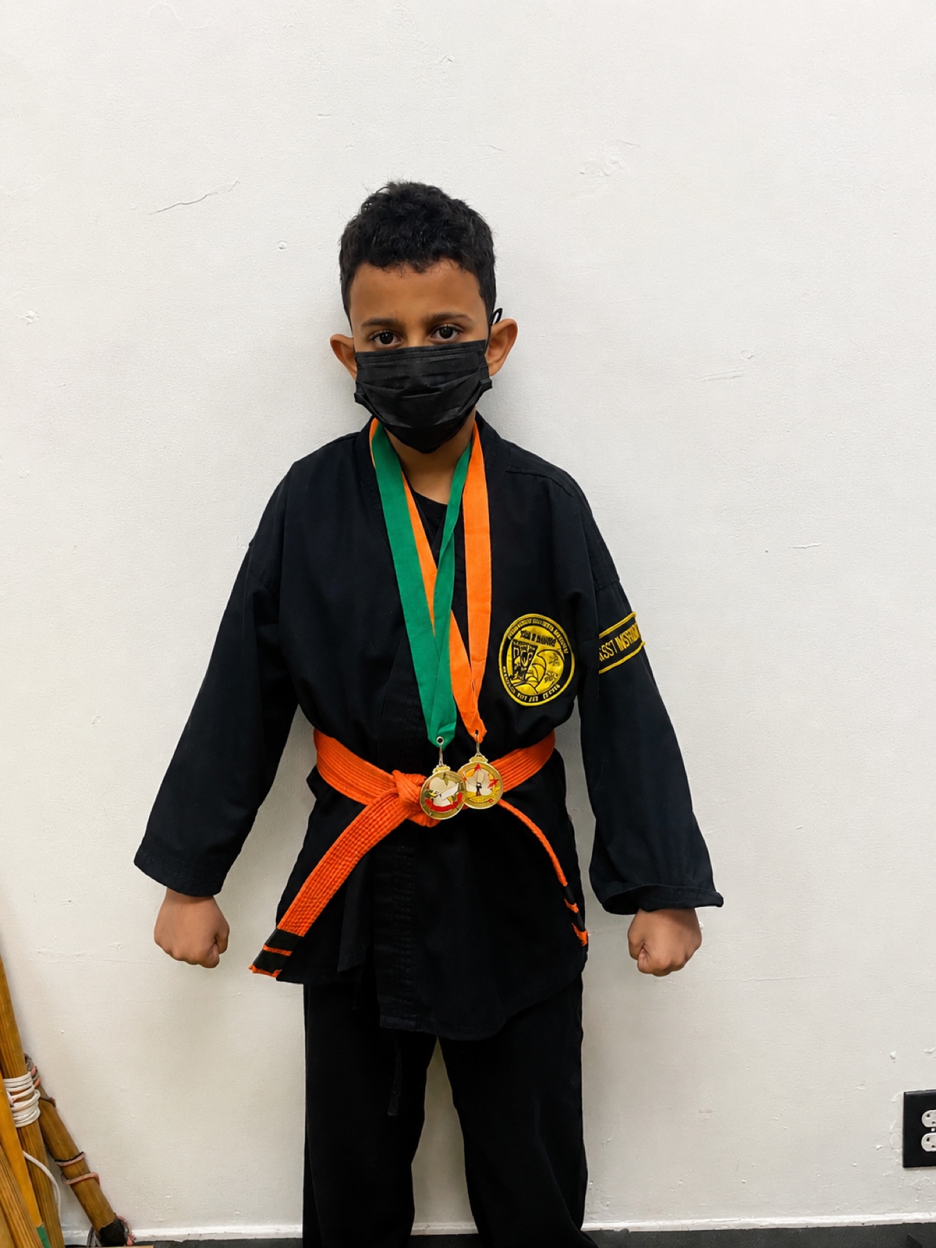 Youth Worthy Ryu student in uniform with medals