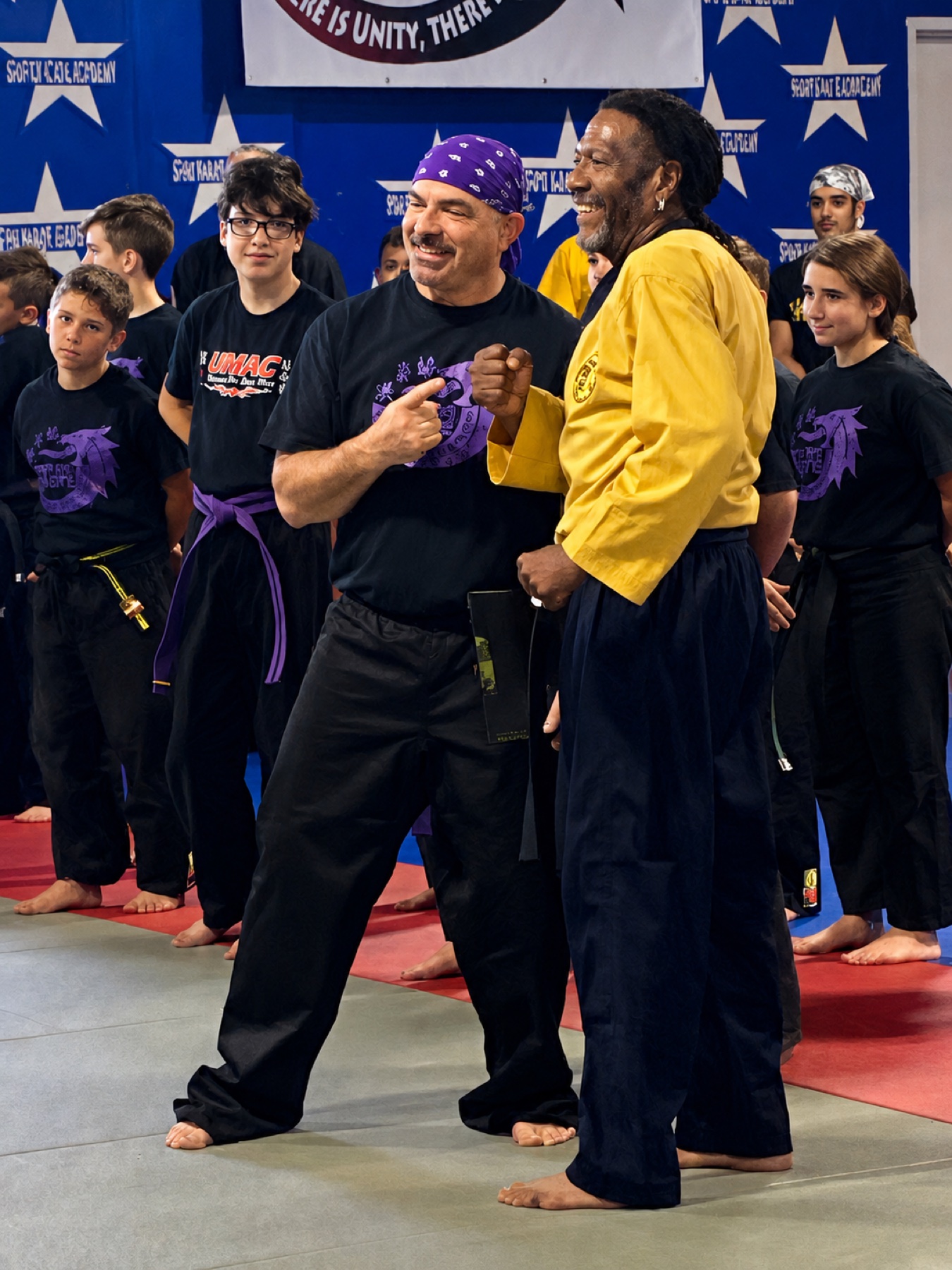 Professor Kenneth Worthy and instructors at a Masters Unite ceremony