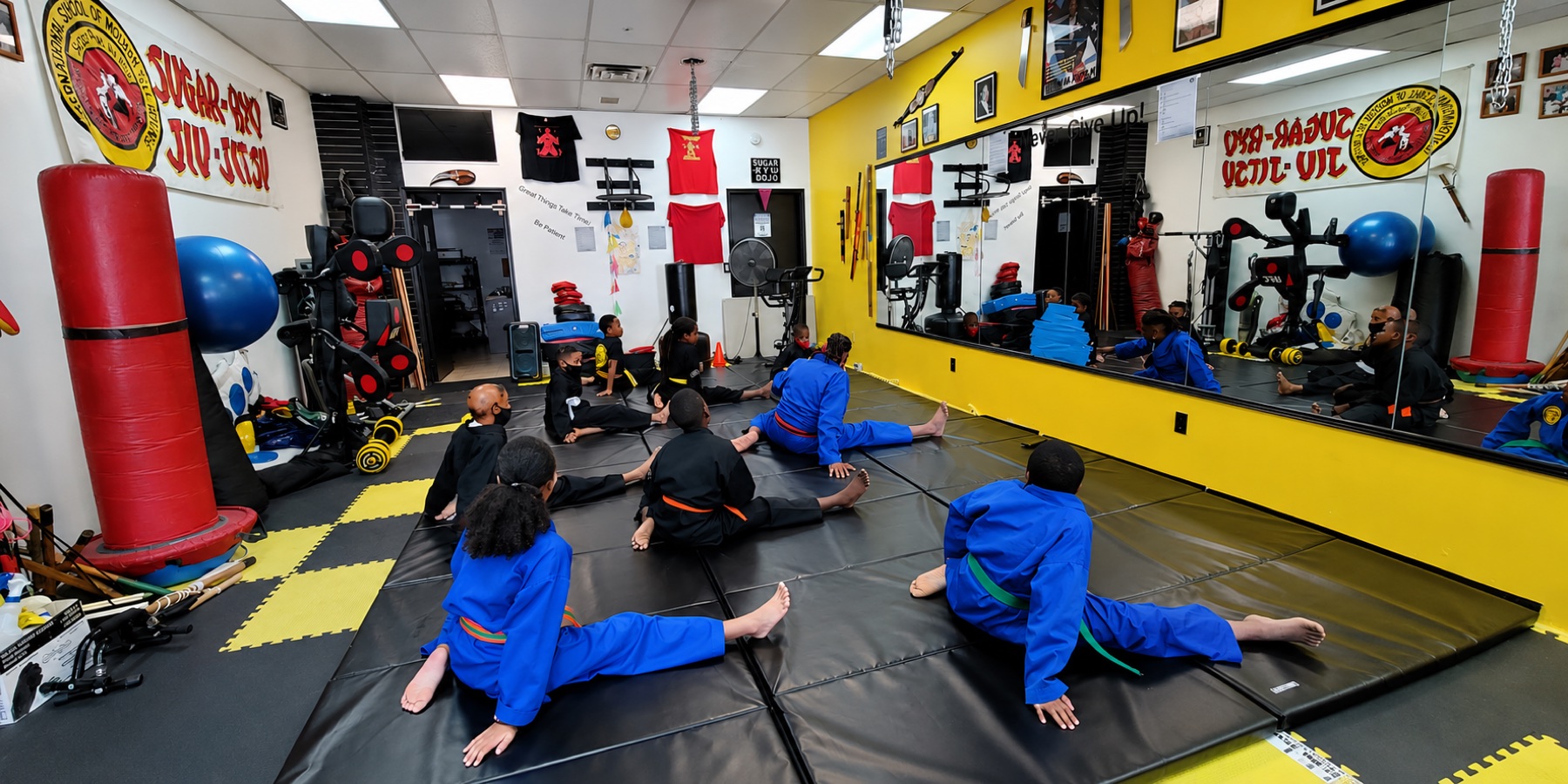Youth martial arts class warming up at Worthy Ryu