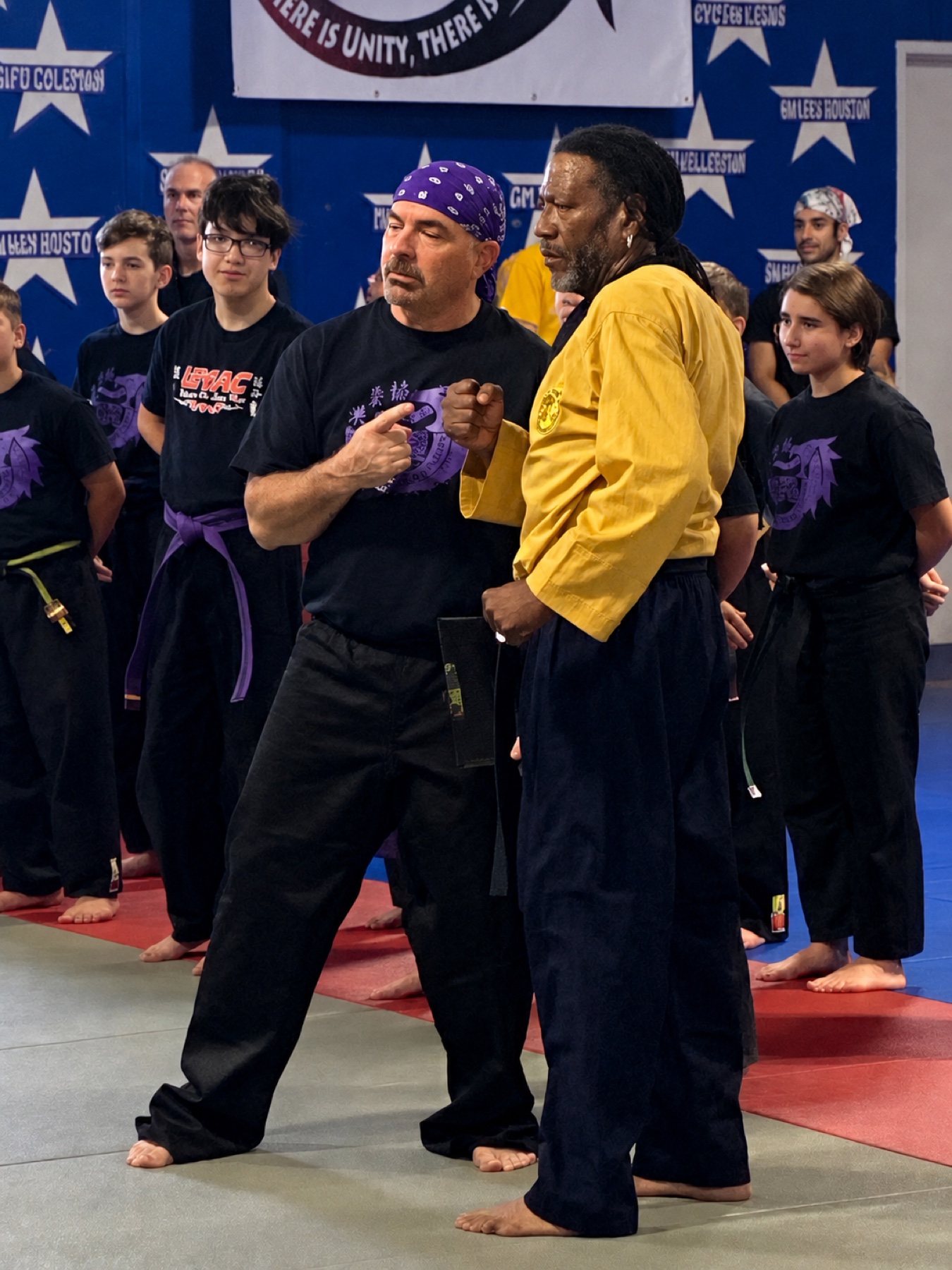 Worthy Ryu instructors sharing a teaching moment during an event